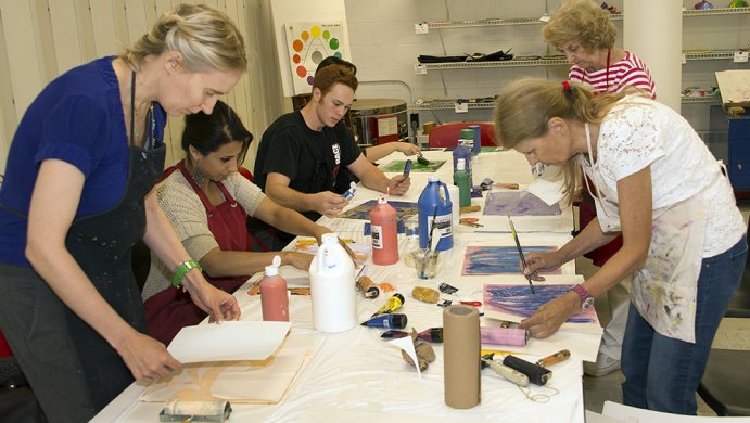 Adults making art in the classrooms