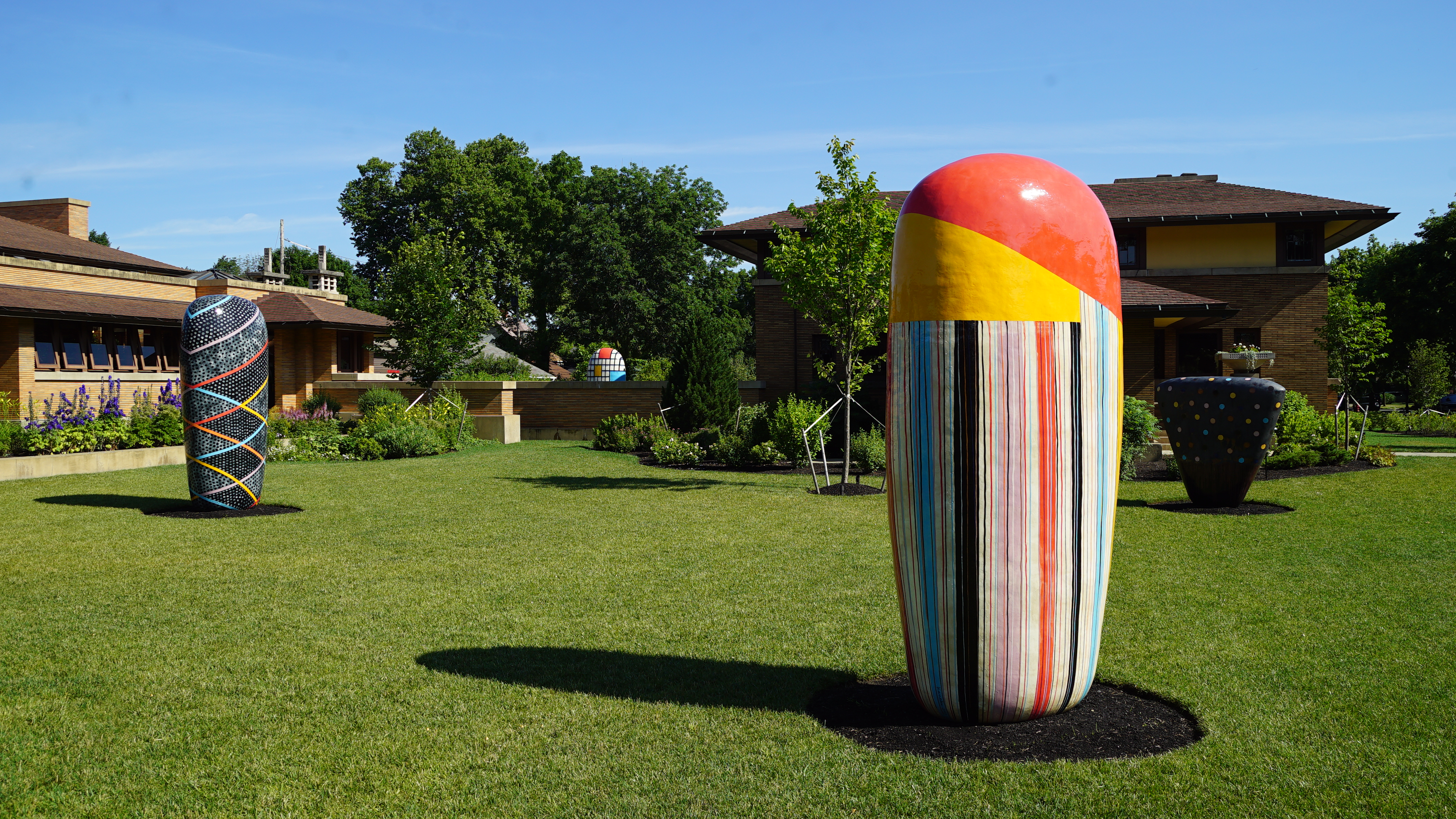 Four ceramic sculptures on the grounds of a historic Frank Lloyd Wright-designed house