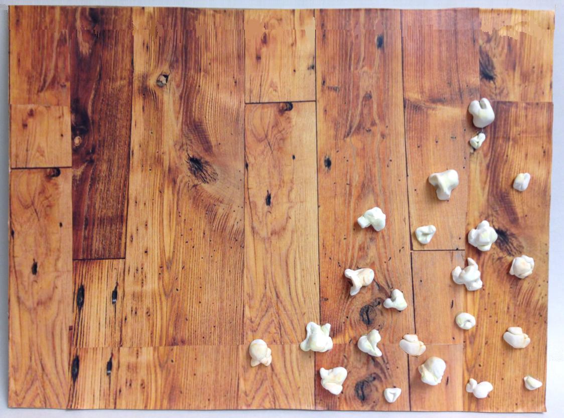 Artwork featuring a wooden floor with popcorn on it