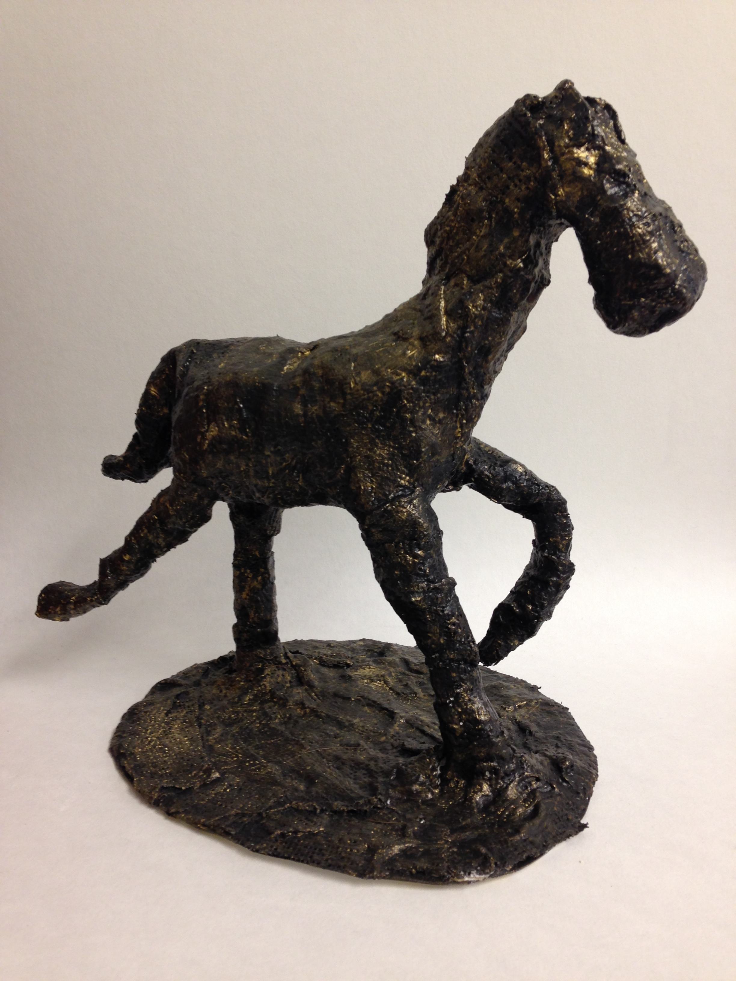 Sculpture of a horse in mid-trot