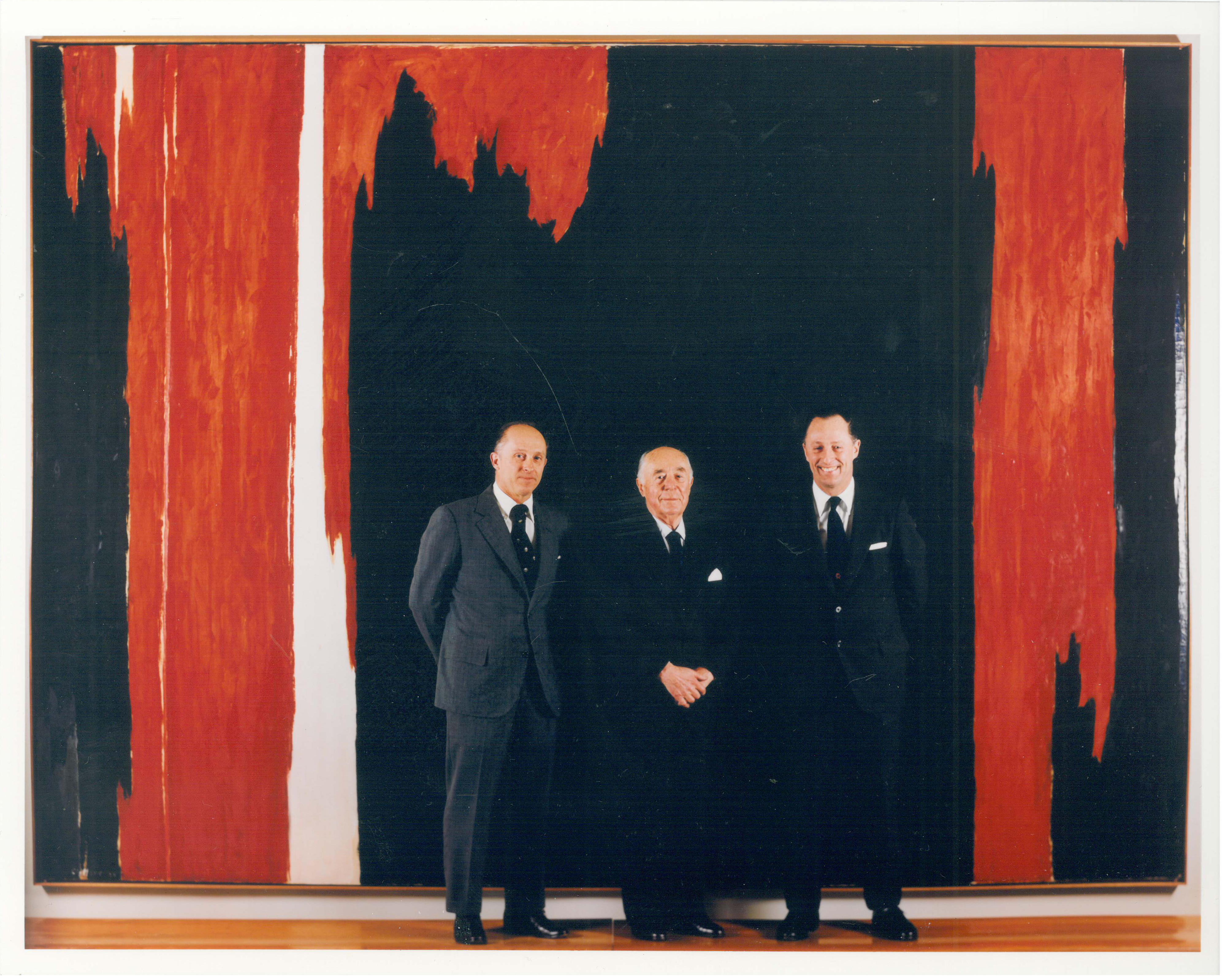 Northrup R. Knox, Seymour H. Knox, Jr., and Seymour H. Knox III in front of Clyfford Still’s PH-49 (1954), 1954