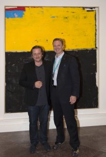 Joe Bradley with Peggy Pierce Elfvin Director Janne Sirén in front of Bradley&#039;s painting Good World, 2017