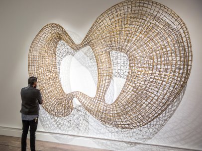 Visitor with Sopheap Pich’s Cycle, 2011, on view in We the People: New Art from the Collection