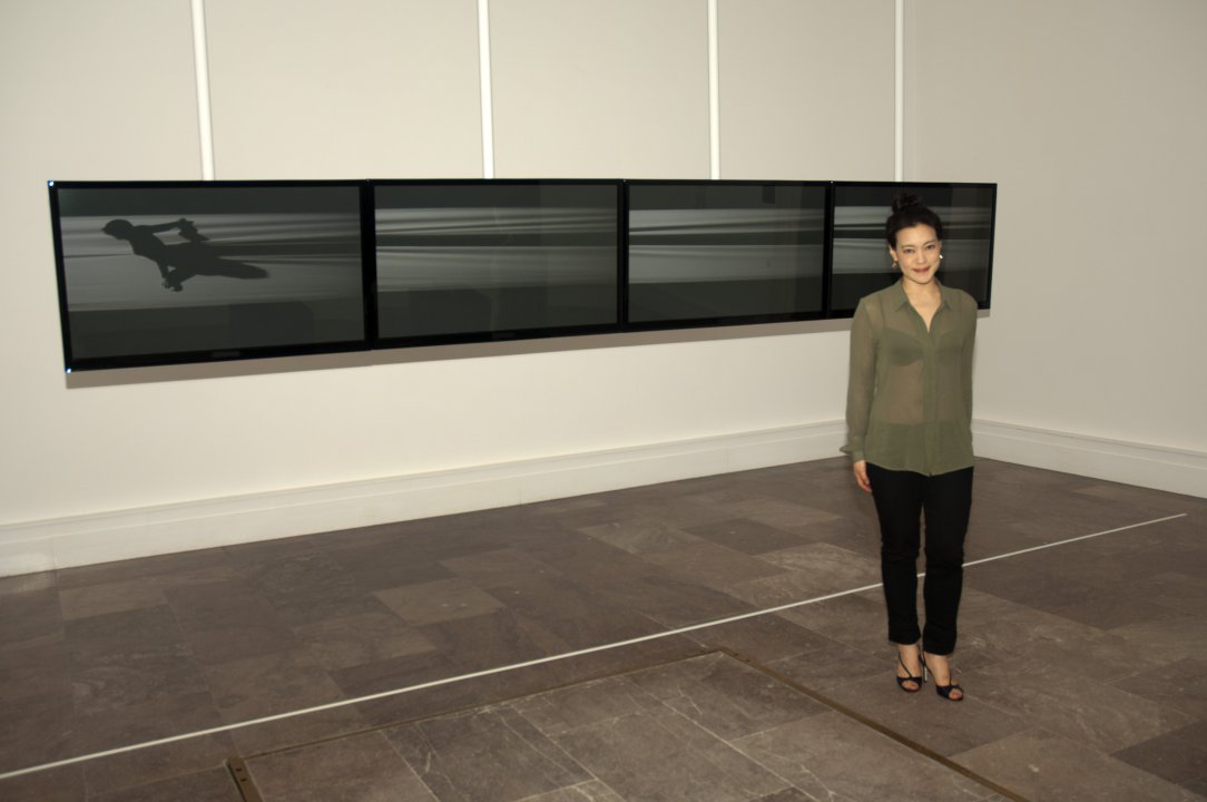 Jaye Rhee with her work Tear, 2002, in Videosphere: A New Generation
