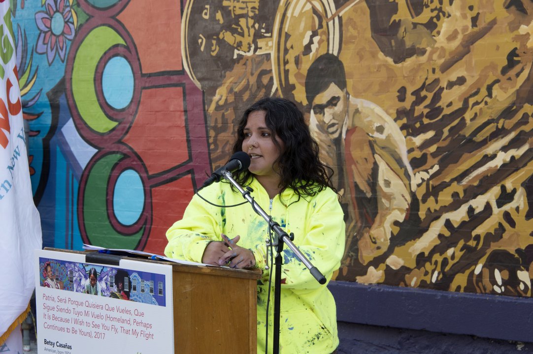 Betsy Casañas speaking at the dedication of her AK Public Art mural, Patria, Será Porque Quisiera Que Vueles, Que Sigue Siendo Tuyo Mi Vuelo (Homeland, Perhaps It Is Because I Wish to See You Fly, That My Flight Continues To Be Yours), on August 25, 2017