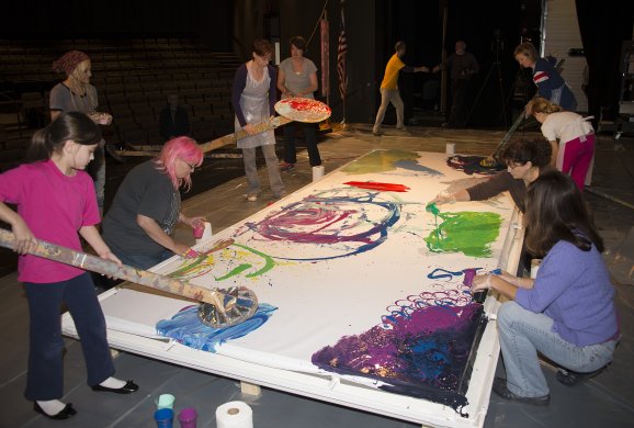 Participants help create Charles Clough&#039;s Hamburg Arena Painting, 2014, at Hilbert College