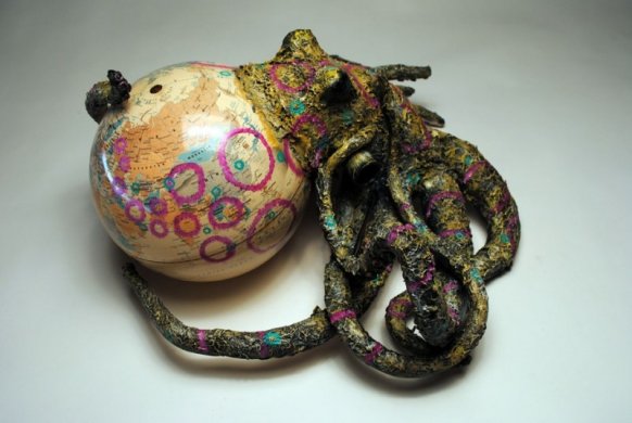 Sculpture of an octopus with a globe as its body