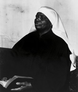 Untitled (Buffalo, Mother Green with bible) from the series Storefront Churches, 1958-1961