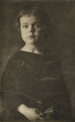 Untitled (portrait of a child with hands folded in lap)