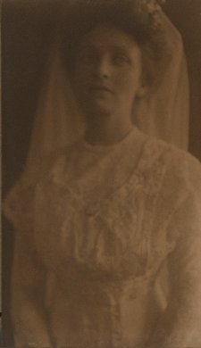 Portrait of Charlotte S. Albright in white dress with veil