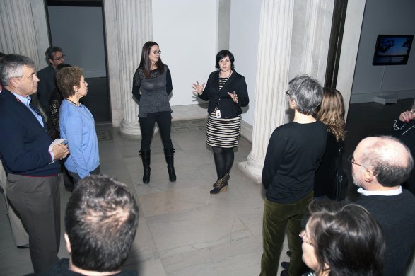Kelly Richardson (center, left) and Albright-Knox Godin-Spaulding Curator & Curator for the Collection Holly E. Hughes (center, right) give a tour of Kelly Richardson: Legion