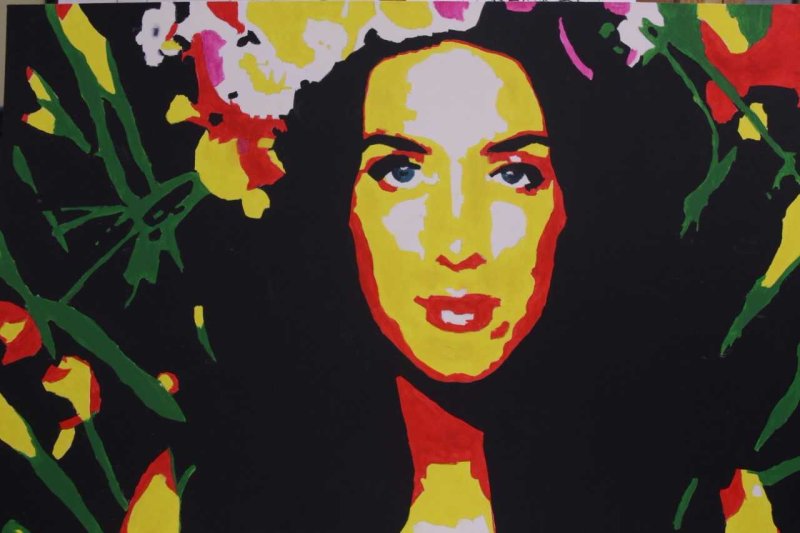 Artwork featuring a woman's face with plants in the background