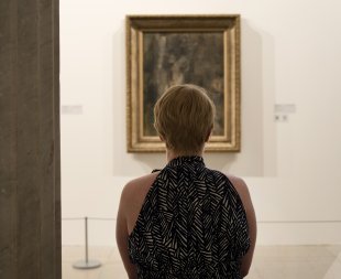 A guest looks at Pablo Picasso&#039;s Nude Figure, 1909–10