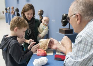 A family interacts with materials on the Albright-Knox&#039;s ArtCart