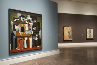 Installation view of Picasso: The Artist and His Models, with Picasso&#039;s Three Musicians, 1921; La toilette, 1906; and Bather, winter 1908–09
