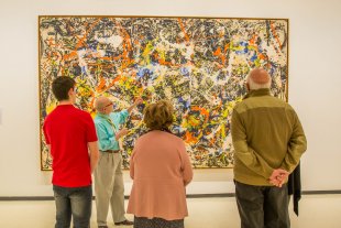 Docent John D’Arcangelo leads a tour in front of Jackson Pollock&#039;s Convergence, 1952