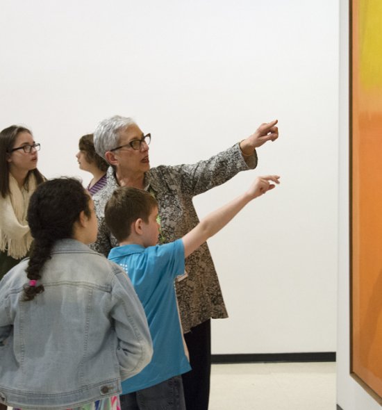 Docent and students with Mark Rothko&#039;s Orange and Yellow, 1956