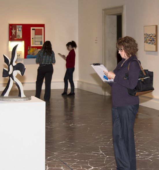 Teachers taking notes about artworks in the galleries
