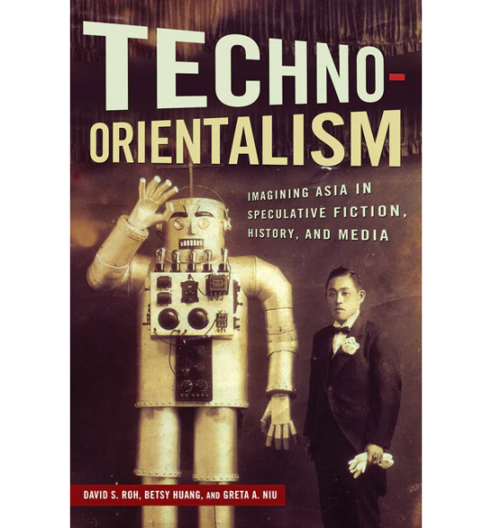 Cover of Techno-Orientalism: a sepia-tone photograph of a person in an old-fashioned suit standing with white gloves in one hand next to a metal robot with its right hand in the air waving