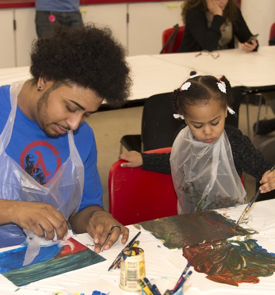Father and daughter making art in the Education Classrooms