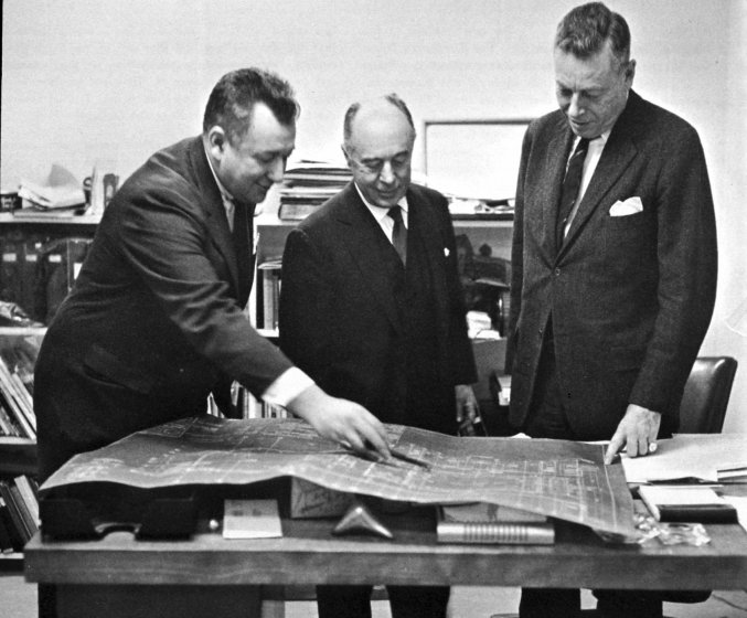 Gordon Bunshaft, Seymour H. Knox, Jr., and Gordon M. Smith study a blueprint