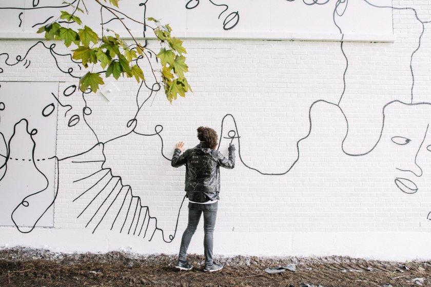 Shantell Martin working on her mural, Dance Everyday, 2017, at 537 East Delavan Avenue