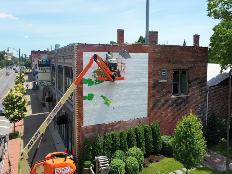 July 1: Artist Augustina Droze begins work on her mural for 2303 Main Street